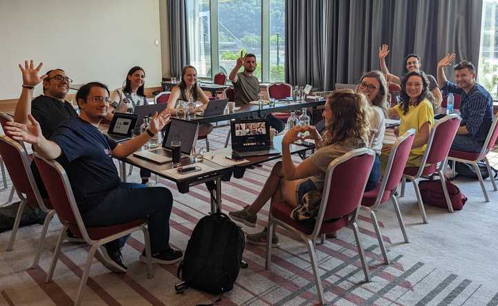 Photo of the people in a conference room, having a meeting